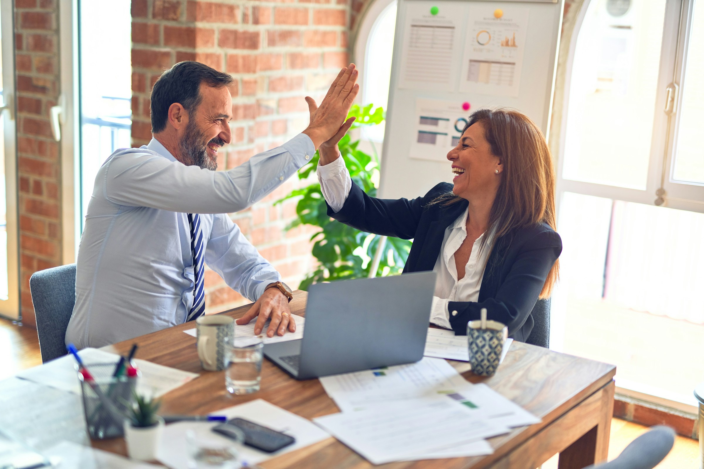 Advisors reviewing financial statements together at a conference table